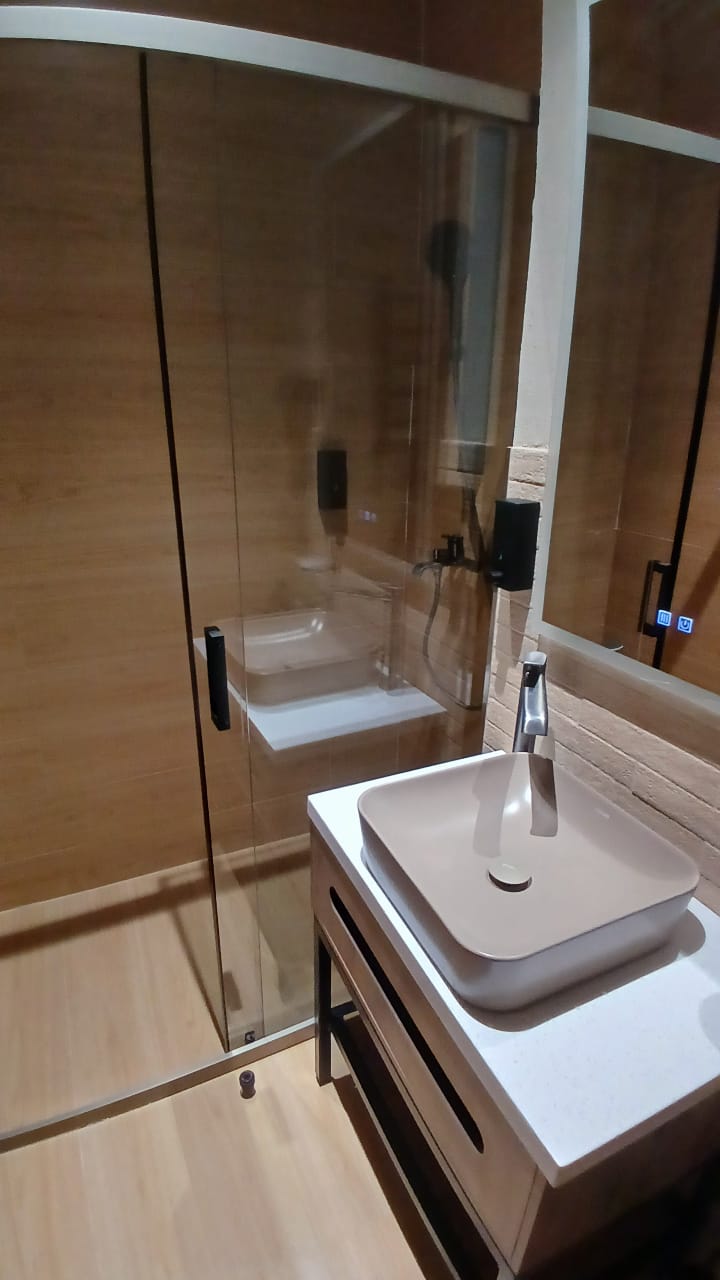 Modern guest bathroom with timber finishes